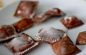 Some different ravioli - chocolate ravioli with cream cheese and aromatic pear sauce