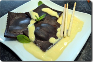 Some different ravioli - chocolate ravioli with cream cheese and aromatic pear sauce