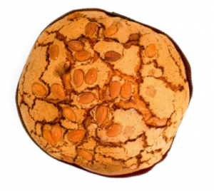 Italy is known all over the world for the culinary delights it offers. It is no secret that these warm homemade delicacies are most magical and captivating when prepared by hand at home. Today we will look at panettone - great for breakfast or dessert with soft and tender, fluffy dough.  To your attention - His Majesty Panettone!   This is a type of Italian sweet bread,  which is something like our Easter cake. It can be said that it is the most emblematic of the Milan region.  It is characterized by its cylindrical shape and in its true form reaches 15-20 cm in height.  Some specimens may exceed 1 kg in weight.    The history of the cake can be traced back to ancient Rome, when it was most often made with honey. During the Holy Roman Empire in the 16th century, the recipe was updated by the famous chef Bartolomeo Scapi. It is believed that the first masters of panettone were Milan bakers.  In the early twentieth century, the cake has gained great popularity throughout Italy.   When is panettone eaten and what distinguishes it from Colombia di Pascha and Brioche?    We have all  seen the cardboard boxes with the inscription panettone,  which have traveled so many kilometers to reach us. Even in Bulgaria it is often offered on the market during the Christmas and New Year holidays. In other countries, including ours, it is sometimes released in stores and around Easter.  For Italians, the consumption of panettone in the spring is a bit unusual. At this time it is more common for them to eat the so-called Easter colombs. These are actually quite similar cakes. They differ from panettone mainly in their shape, but also in the fact that their raisins are replaced by caramelized citrus peels.  To some extent, it can be said that panettone is a variation of the popular Italian kozunak brioche.  The difference between the two is in the cooking time and also in the yeast.  Sweet brioche breads need only a few astronomical hours to rise, while panettone takes more than 50 hours. Also, panettone is mixed with natural yeast, while bread is used for brioche. To swell to an enviable height, they are hooked and hung for a long time.  It is interesting to note that not all panettone is produced in Italy.  Producers and traders from South America and even Asia make a steady income from panettone.  Some Italians are not at all happy about this, as they perceive it as an abuse of their culinary traditions.  That is why there is a  heated political struggle there to give it the status of food with a protected geographical origin  (in Italian abbreviated DOP), as have other typical // dishes in Italian cuisine.// This does not mean that the products and the recipe for this temptation are a secret.  The DOP label would mean that panettone is made only from local products, ie grown in Italy. Unfortunately, this is very difficult in this case, as the country imports most of the flour, sugar, raisins and the huge technological time required for its preparation.  Can we make a mini panettone at home?  Fortunately, there is a way to make sweet, small panettone cakes completely on your own and without going through 50 hours of preparation.  Products  We will need:  •	500 g flour (type 500) •	200 g of soft butter •	2 whole eggs, 1 more yolk separately •	1 tsp vanilla •	200 ml of warm milk •	100 g powdered sugar •	150 g raisins •	pinch of salt. •	In this case we will use 2 packets of dry yeast, 30 g of almond flakes.    Method of preparation  •	Beat the two egg whites and the three egg yolks with the vanilla.  We prepare a large bowl in which to mix the dry products - flour, yeast, sugar and a pinch of salt. •	Then  add the eggs and milk  to the mixture, starting to stir with a wooden spoon until a sticky dough is obtained. Now we have to cover it with kitchen foil, put it warm and wait for it to double in size. •	After the first rising, it is time to add the butter and raisins. Then divide the dough into small balls and leave them to rise for the last time before baking. •	Now we can  turn on the oven at 180 degrees  and finalize our mini panettone. We use paper muffin tins. It is best to put them in a silicone or metal mold so that they do not spread. •	Before we start baking, spread the mini cakes with milk. They need  about 30 minutes to be ready.      When cool, fluffy panettone muffins are ready to serve . You can offer them to your guests with a spoonful of the famous  Italian gelato or mascarpone,  served on the side, and a topping of chocolate, syrup or marmalade, or you can turn them into real cupcakes by placing cream and topping directly on them. They can be eaten for breakfast with a cup of coffee or hot chocolate, and also as a dessert or snack in the afternoon.  They go well with Italian wine in the evening. 