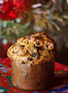 Italy is known all over the world for the culinary delights it offers. It is no secret that these warm homemade delicacies are most magical and captivating when prepared by hand at home. Today we will look at panettone - great for breakfast or dessert with soft and tender, fluffy dough.  To your attention - His Majesty Panettone!   This is a type of Italian sweet bread,  which is something like our Easter cake. It can be said that it is the most emblematic of the Milan region.  It is characterized by its cylindrical shape and in its true form reaches 15-20 cm in height.  Some specimens may exceed 1 kg in weight.    The history of the cake can be traced back to ancient Rome, when it was most often made with honey. During the Holy Roman Empire in the 16th century, the recipe was updated by the famous chef Bartolomeo Scapi. It is believed that the first masters of panettone were Milan bakers.  In the early twentieth century, the cake has gained great popularity throughout Italy.   When is panettone eaten and what distinguishes it from Colombia di Pascha and Brioche?    We have all  seen the cardboard boxes with the inscription panettone,  which have traveled so many kilometers to reach us. Even in Bulgaria it is often offered on the market during the Christmas and New Year holidays. In other countries, including ours, it is sometimes released in stores and around Easter.  For Italians, the consumption of panettone in the spring is a bit unusual. At this time it is more common for them to eat the so-called Easter colombs. These are actually quite similar cakes. They differ from panettone mainly in their shape, but also in the fact that their raisins are replaced by caramelized citrus peels.  To some extent, it can be said that panettone is a variation of the popular Italian kozunak brioche.  The difference between the two is in the cooking time and also in the yeast.  Sweet brioche breads need only a few astronomical hours to rise, while panettone takes more than 50 hours. Also, panettone is mixed with natural yeast, while bread is used for brioche. To swell to an enviable height, they are hooked and hung for a long time.  It is interesting to note that not all panettone is produced in Italy.  Producers and traders from South America and even Asia make a steady income from panettone.  Some Italians are not at all happy about this, as they perceive it as an abuse of their culinary traditions.  That is why there is a  heated political struggle there to give it the status of food with a protected geographical origin  (in Italian abbreviated DOP), as have other typical // dishes in Italian cuisine.// This does not mean that the products and the recipe for this temptation are a secret.  The DOP label would mean that panettone is made only from local products, ie grown in Italy. Unfortunately, this is very difficult in this case, as the country imports most of the flour, sugar, raisins and the huge technological time required for its preparation.  Can we make a mini panettone at home?  Fortunately, there is a way to make sweet, small panettone cakes completely on your own and without going through 50 hours of preparation.  Products  We will need:  •	500 g flour (type 500) •	200 g of soft butter •	2 whole eggs, 1 more yolk separately •	1 tsp vanilla •	200 ml of warm milk •	100 g powdered sugar •	150 g raisins •	pinch of salt. •	In this case we will use 2 packets of dry yeast, 30 g of almond flakes.    Method of preparation  •	Beat the two egg whites and the three egg yolks with the vanilla.  We prepare a large bowl in which to mix the dry products - flour, yeast, sugar and a pinch of salt. •	Then  add the eggs and milk  to the mixture, starting to stir with a wooden spoon until a sticky dough is obtained. Now we have to cover it with kitchen foil, put it warm and wait for it to double in size. •	After the first rising, it is time to add the butter and raisins. Then divide the dough into small balls and leave them to rise for the last time before baking. •	Now we can  turn on the oven at 180 degrees  and finalize our mini panettone. We use paper muffin tins. It is best to put them in a silicone or metal mold so that they do not spread. •	Before we start baking, spread the mini cakes with milk. They need  about 30 minutes to be ready.      When cool, fluffy panettone muffins are ready to serve . You can offer them to your guests with a spoonful of the famous  Italian gelato or mascarpone,  served on the side, and a topping of chocolate, syrup or marmalade, or you can turn them into real cupcakes by placing cream and topping directly on them. They can be eaten for breakfast with a cup of coffee or hot chocolate, and also as a dessert or snack in the afternoon.  They go well with Italian wine in the evening. 