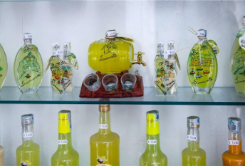 Premium Photo  Italian drink lemon liqueur limoncello in glasses on the  wooden table.